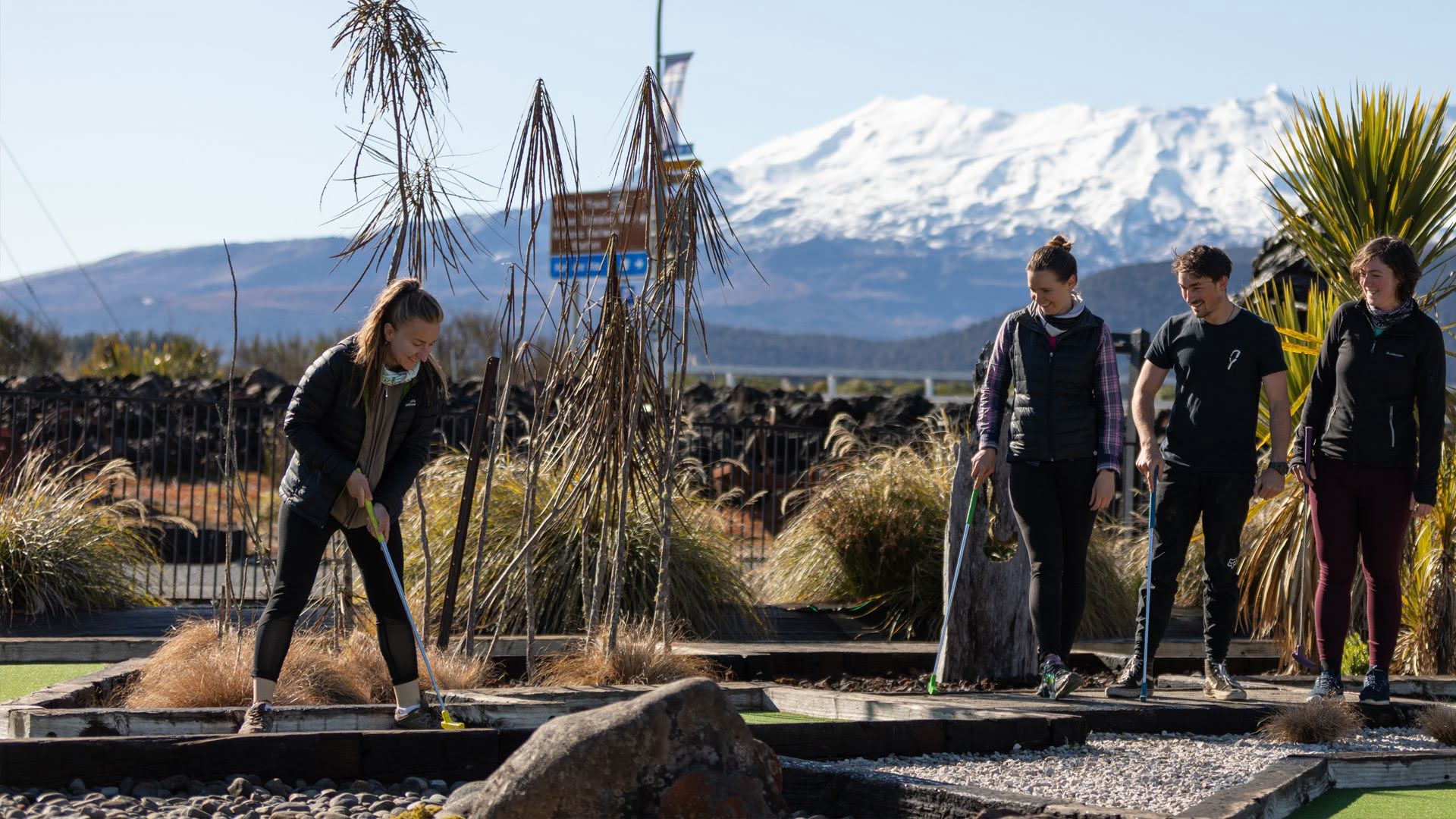 Friends playing minigolf in National Park Village - Visit Ruapehu.jpg